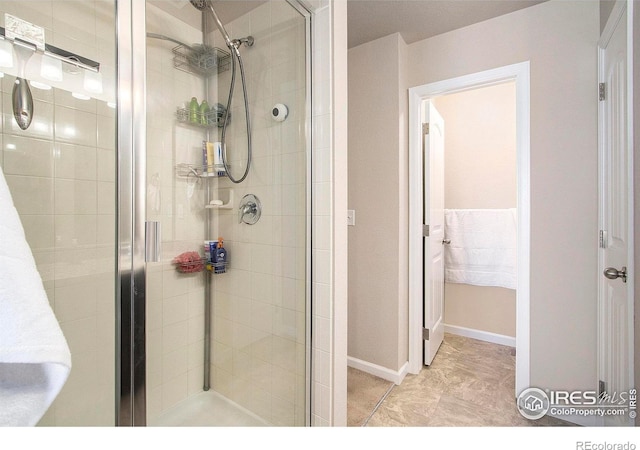 bathroom featuring a shower stall
