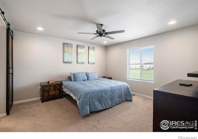 bedroom featuring carpet, baseboards, recessed lighting, ceiling fan, and a textured ceiling