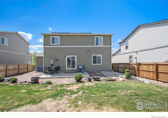 rear view of property featuring a patio