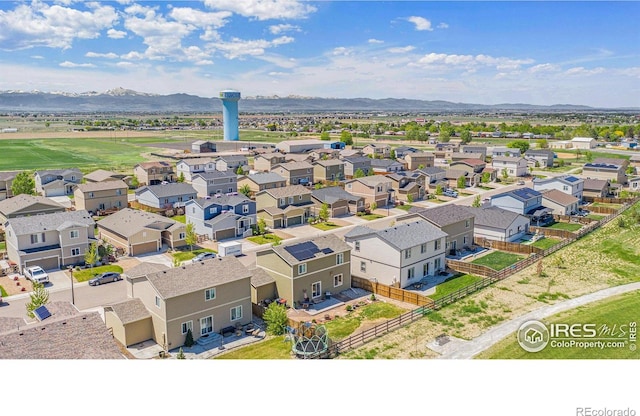 aerial perspective of suburban area featuring a mountain backdrop