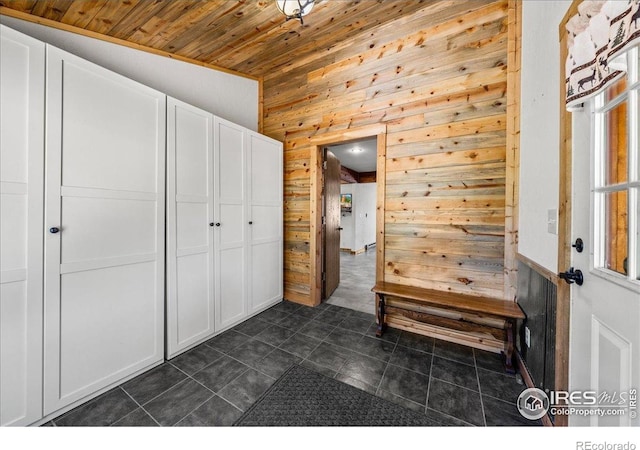 457 Spruce Mountain Dr, Drake, CO 80515 - mudroom with wooden walls, wood ceiling, and dark tile patterned flooring