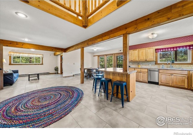457 Spruce Mountain Dr, Drake, CO 80515 - kitchen with dishwasher, a breakfast bar, open floor plan, a center island, and a sink