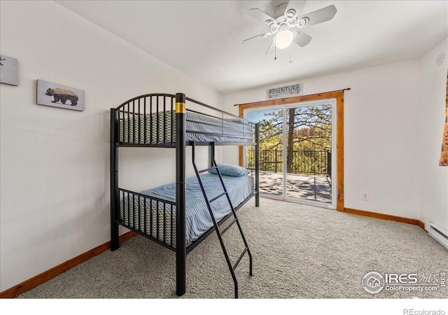 457 Spruce Mountain Dr, Drake, CO 80515 - bedroom featuring carpet floors, access to exterior, and baseboards