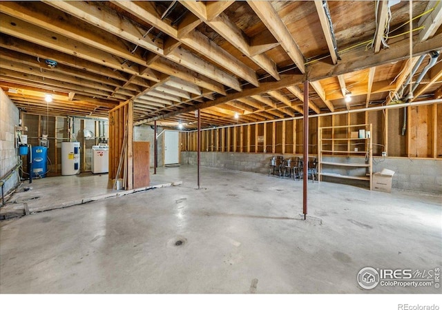457 Spruce Mountain Dr, Drake, CO 80515 - unfinished below grade area with water heater and a water pressure tank