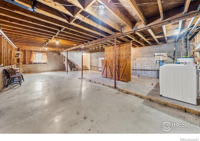 457 Spruce Mountain Dr, Drake, CO 80515 - below grade area featuring washer / dryer, stairs, and concrete block wall