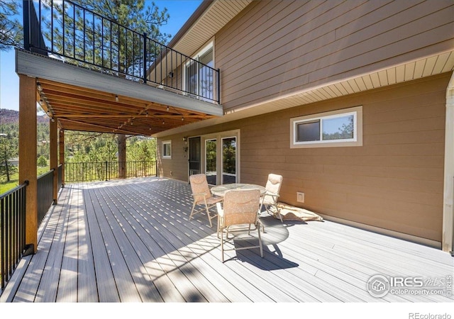 457 Spruce Mountain Dr, Drake, CO 80515 - wooden terrace with outdoor dining area