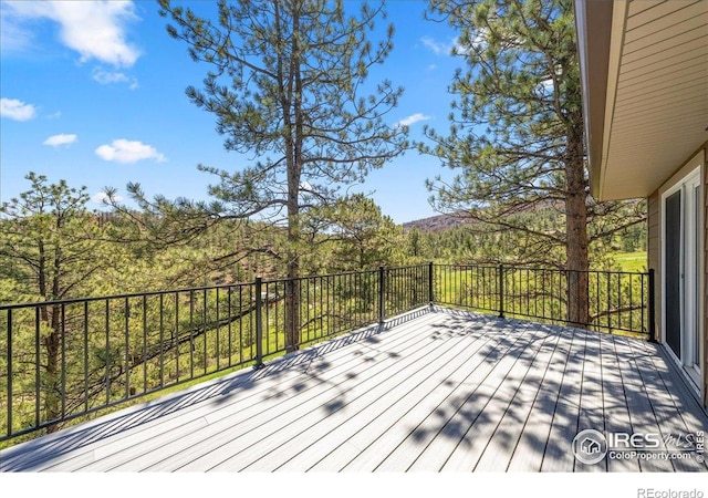 457 Spruce Mountain Dr, Drake, CO 80515 - wooden terrace with a forest view