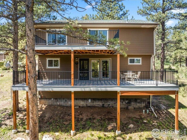 457 Spruce Mountain Dr, Drake, CO 80515 - back of house featuring a deck and a balcony