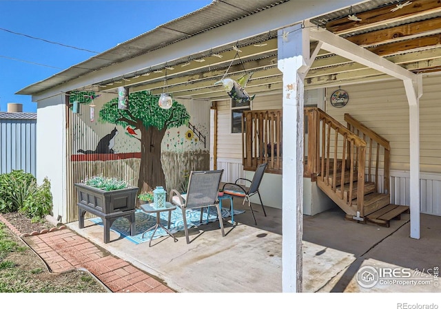 view of patio / terrace featuring fence