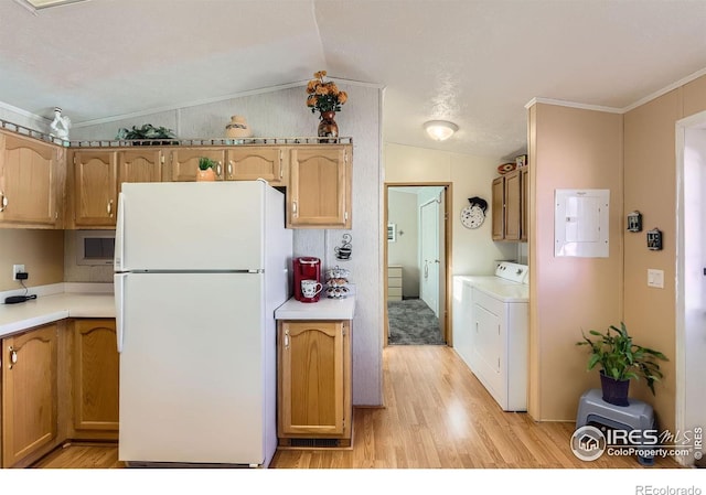kitchen with freestanding refrigerator, washing machine and clothes dryer, electric panel, lofted ceiling, and light wood-style floors