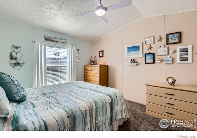 carpeted bedroom with lofted ceiling, ornamental molding, a textured ceiling, and ceiling fan