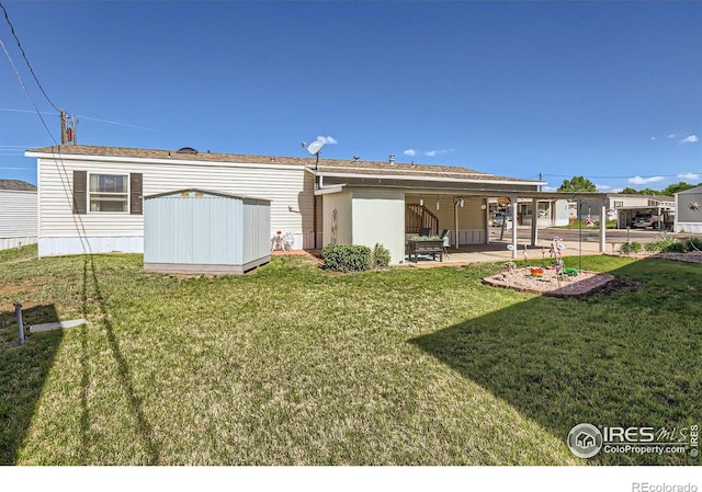 back of property with a patio and a yard