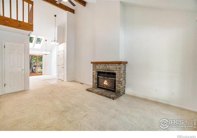 2066 Weathertop Ln, Fort Collins, CO 80526 - unfurnished living room with high vaulted ceiling, carpet flooring, a chandelier, a fireplace, and ceiling fan