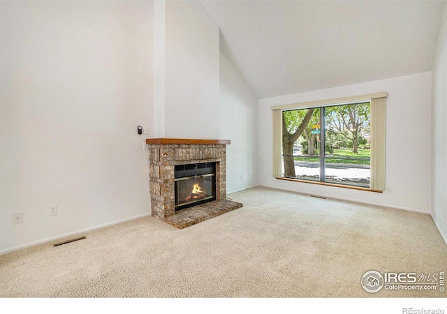 2066 Weathertop Ln, Fort Collins, CO 80526 - unfurnished living room featuring lofted ceiling, carpet flooring, a brick fireplace, and baseboards