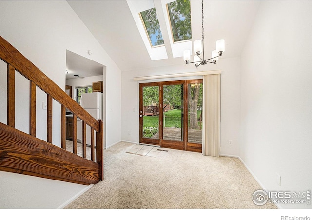 2066 Weathertop Ln, Fort Collins, CO 80526 - carpeted entrance foyer with a chandelier, baseboards, stairs, vaulted ceiling, and a skylight