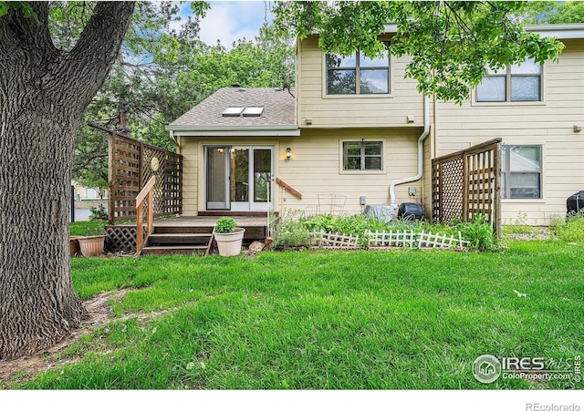 2066 Weathertop Ln, Fort Collins, CO 80526 - back of house featuring a yard, a deck, stairs, and roof with shingles