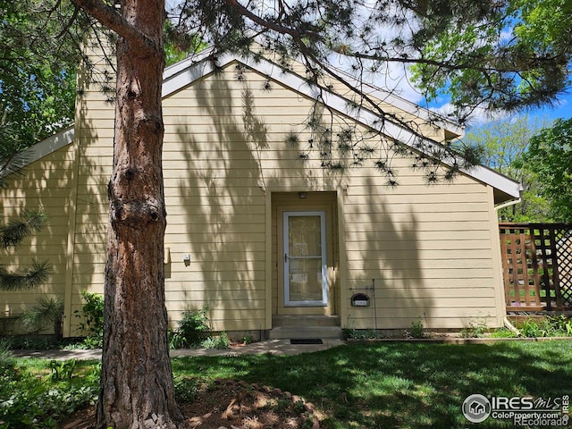2066 Weathertop Ln, Fort Collins, CO 80526 - rear view of house with entry steps and a yard