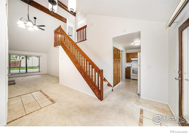 2066 Weathertop Ln, Fort Collins, CO 80526 - stairway featuring carpet flooring, a chandelier, high vaulted ceiling, and baseboards