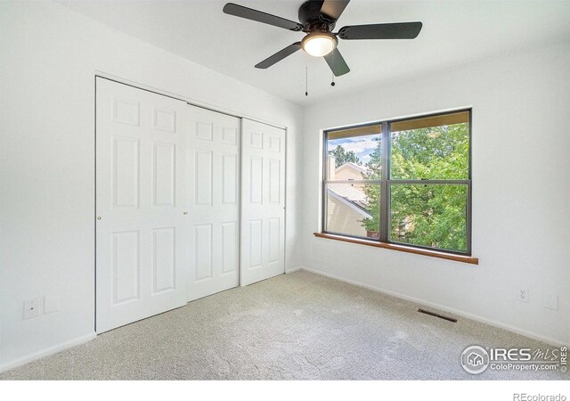 2066 Weathertop Ln, Fort Collins, CO 80526 - unfurnished bedroom with carpet, a closet, baseboards, and ceiling fan
