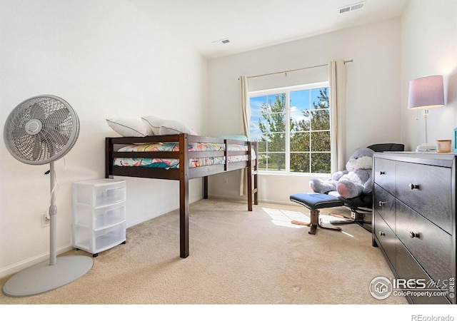 carpeted bedroom featuring baseboards