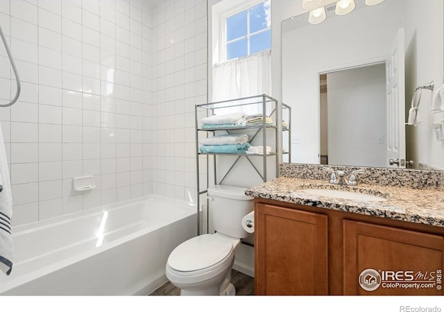 full bathroom with vanity, toilet, and bathtub / shower combination