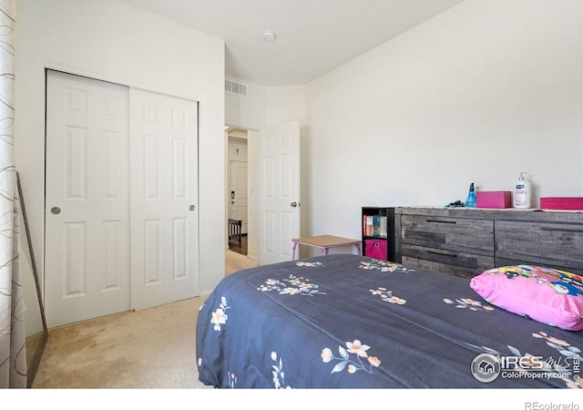 bedroom with carpet floors and a closet
