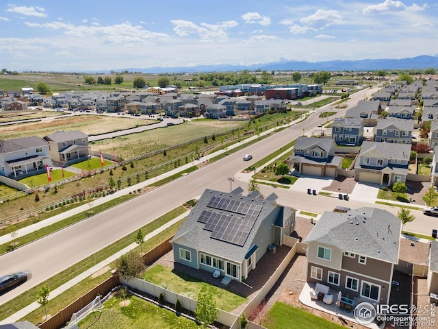 aerial view of residential area featuring a mountainous background