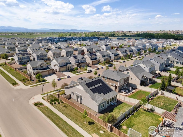 aerial perspective of suburban area with a mountainous background