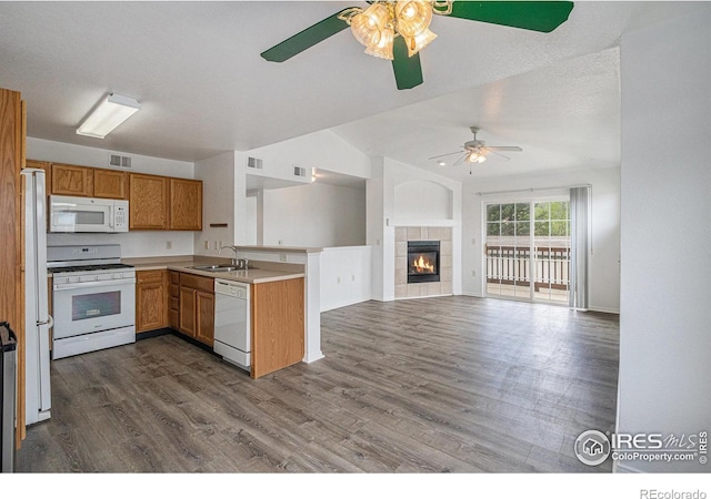 3002 W Elizabeth St Unit G, Fort Collins, CO 80521 - kitchen featuring white appliances, a sink, ceiling fan, a peninsula, and open floor plan