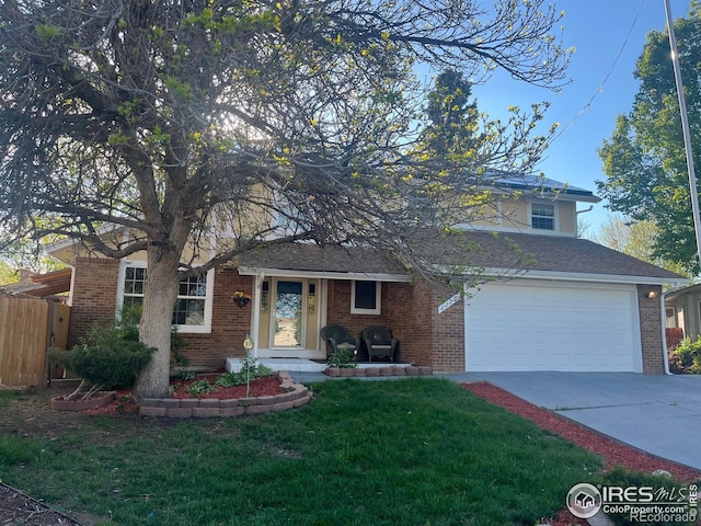 view of front of property featuring concrete driveway, brick siding, and a garage