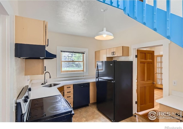 3116 47th St, Boulder, CO 80301 - kitchen featuring black appliances, a sink, under cabinet range hood, light brown cabinetry, and light countertops