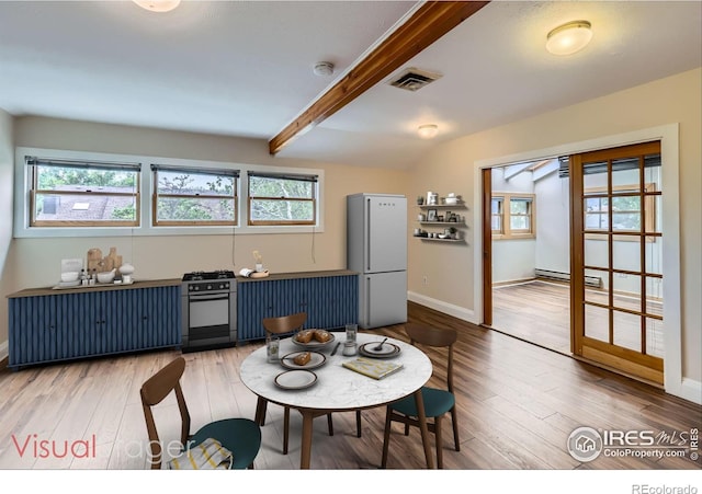 3116 47th St, Boulder, CO 80301 - dining space with plenty of natural light, light wood-style floors, beamed ceiling, and baseboards