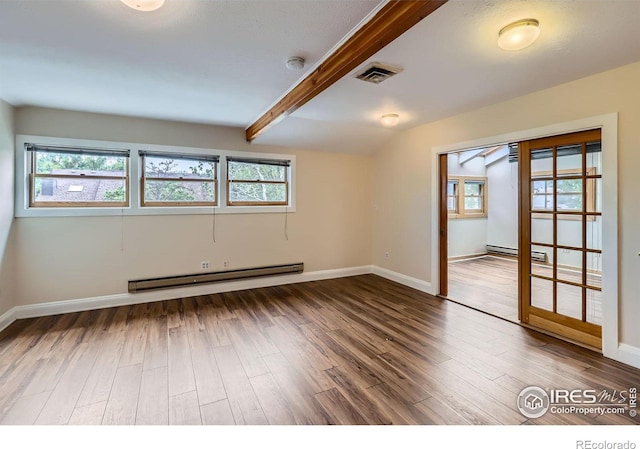 3116 47th St, Boulder, CO 80301 - unfurnished room with a baseboard radiator, healthy amount of natural light, and wood finished floors