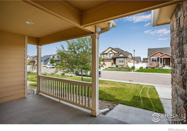 7505 Little Fox Ln, Wellington, CO 80549 - view of patio / terrace with a residential view and a porch