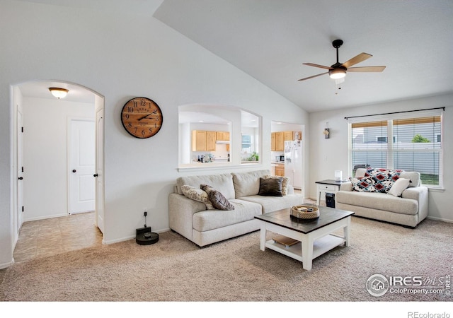 7505 Little Fox Ln, Wellington, CO 80549 - living room with a ceiling fan, arched walkways, carpet flooring, baseboards, and high vaulted ceiling