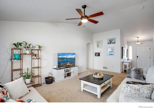 7505 Little Fox Ln, Wellington, CO 80549 - carpeted living area with a ceiling fan, arched walkways, and vaulted ceiling
