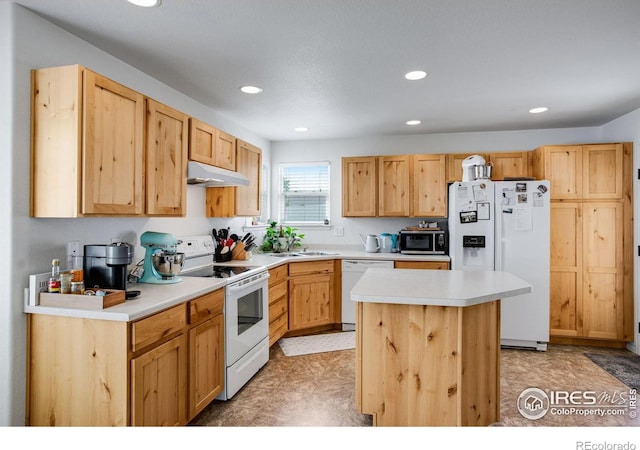 7505 Little Fox Ln, Wellington, CO 80549 - kitchen featuring white appliances, under cabinet range hood, light countertops, recessed lighting, and a center island