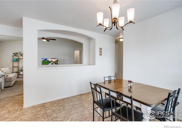 7505 Little Fox Ln, Wellington, CO 80549 - dining area featuring ceiling fan, a chandelier, and baseboards