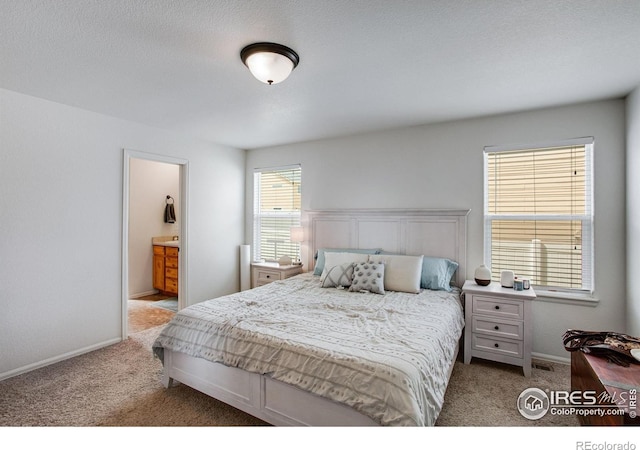 7505 Little Fox Ln, Wellington, CO 80549 - carpeted bedroom featuring baseboards and ensuite bath