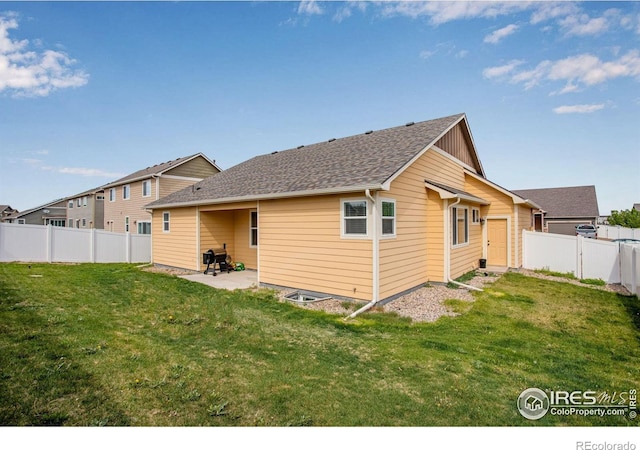 7505 Little Fox Ln, Wellington, CO 80549 - rear view of property with a patio and roof with shingles