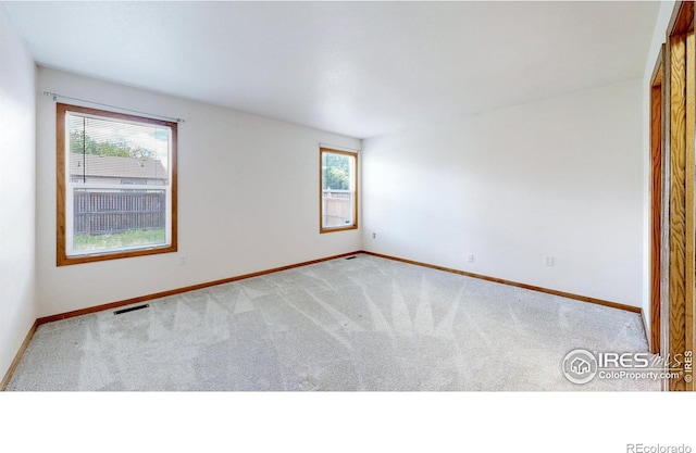 374 Blue Azurite Ave, Loveland, CO 80537 - carpeted empty room featuring healthy amount of natural light and baseboards