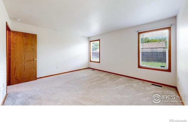 374 Blue Azurite Ave, Loveland, CO 80537 - carpeted empty room featuring baseboards and a smoke detector