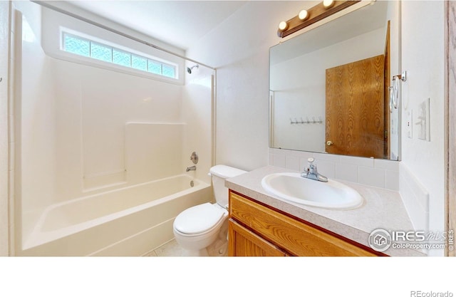 374 Blue Azurite Ave, Loveland, CO 80537 - bathroom featuring toilet, vanity, and washtub / shower combination