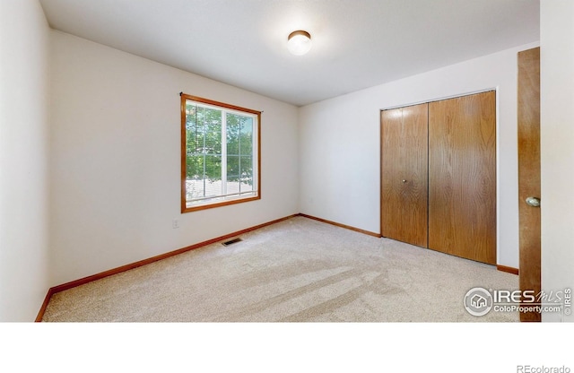374 Blue Azurite Ave, Loveland, CO 80537 - unfurnished bedroom featuring carpet flooring, baseboards, and a closet