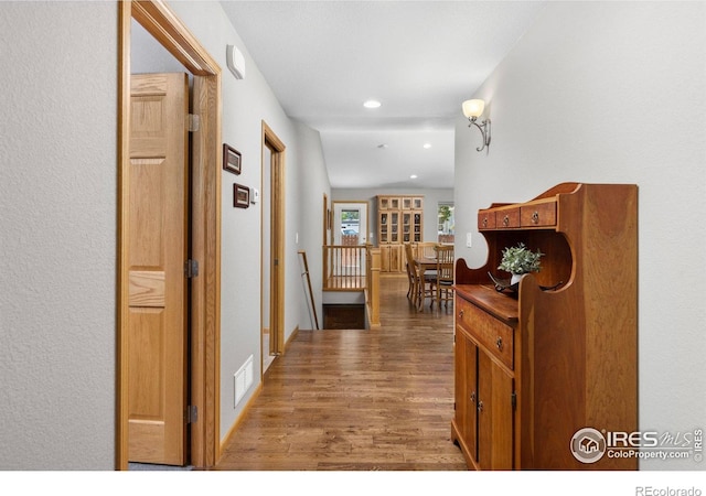 1918 Lily Dr, Loveland, CO 80537 - corridor with wood finished floors, recessed lighting, and an upstairs landing