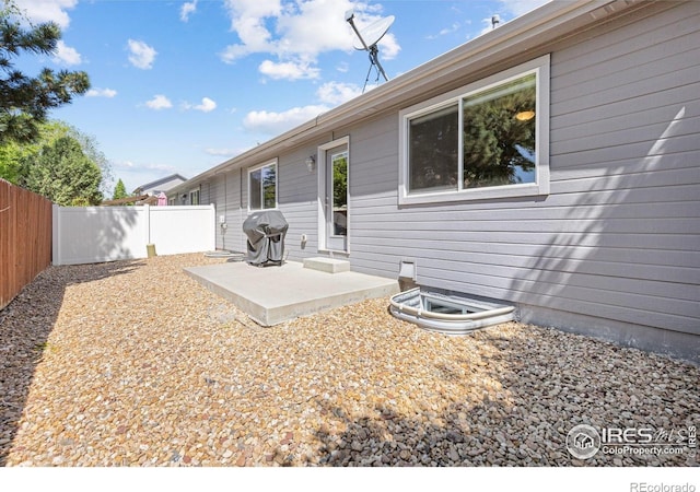 1918 Lily Dr, Loveland, CO 80537 - back of property featuring fence and a patio