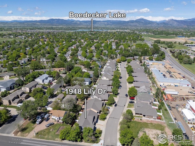 1918 Lily Dr, Loveland, CO 80537 - aerial overview of property's location with mountains and nearby suburban area