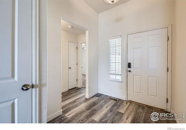 4134 Cypress Ridge Ln, Wellington, CO 80549 - foyer entrance with wood finished floors and baseboards