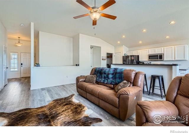 4134 Cypress Ridge Ln, Wellington, CO 80549 - living room with a ceiling fan, wood finished floors, lofted ceiling, and recessed lighting