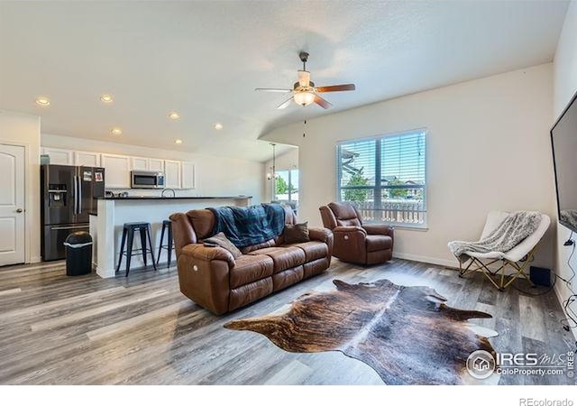 4134 Cypress Ridge Ln, Wellington, CO 80549 - living room featuring light wood-type flooring, a ceiling fan, baseboards, and recessed lighting